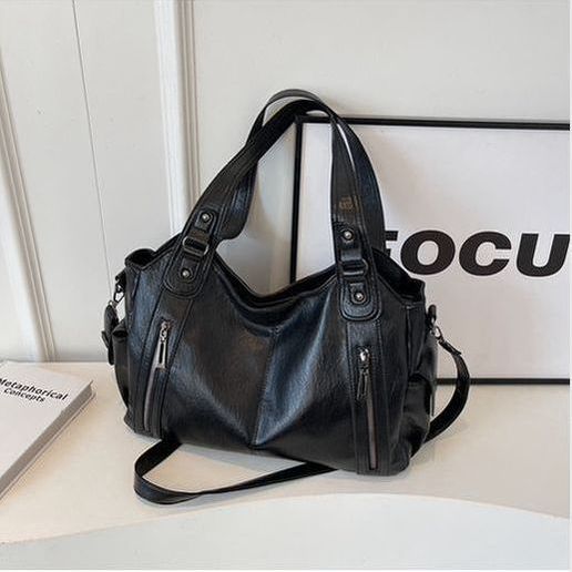 תיק עור של טל