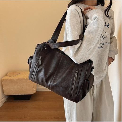 תיק עור של טל